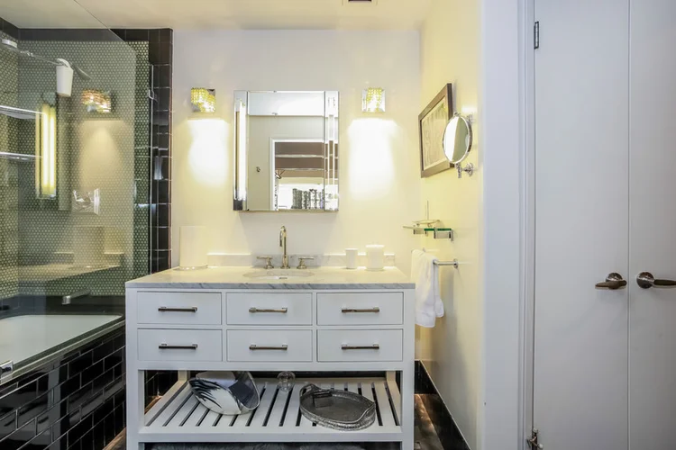 Marble vanity & black tile