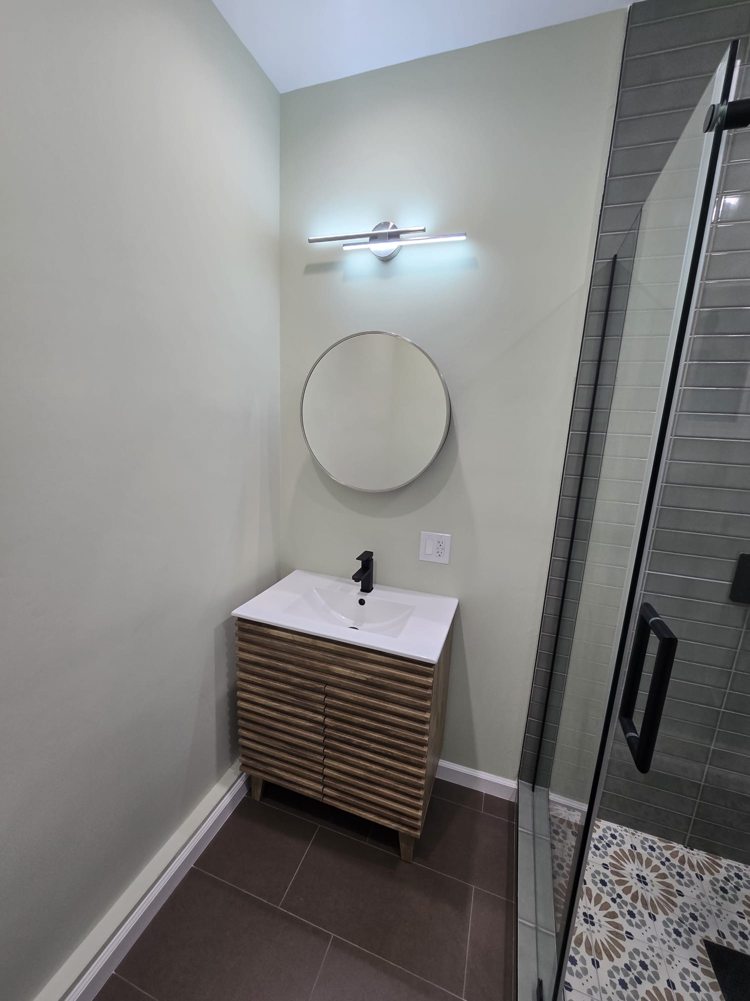 Sage powder room with fluted vanity