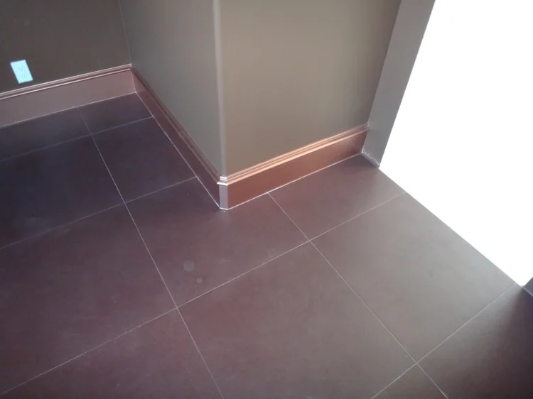 Large-format tile with copper trim