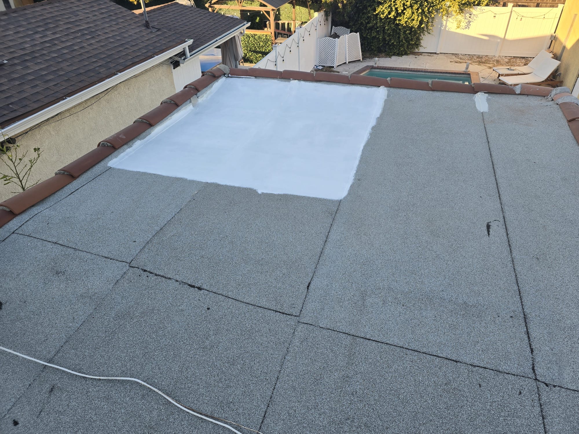 Flat roof coating repair section